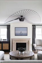 Load image into Gallery viewer, A stylish living room showcasing 'Beach Wall Decor - Lost Sea Swing 021' framed above a fireplace, harmonizing modern interior design with serene beach aesthetics, making it a perfect focal point for coastal decor lovers.