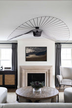 Load image into Gallery viewer, An elegant interior showcasing a framed Ocean Picture titled 'Lowtide Swash 021,' hung above a fireplace, enhancing the room's decor with a touch of coastal elegance.