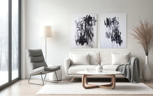 Load image into Gallery viewer, Black White Contemporary Art - What+When in a serene, minimalist room, showcasing two large artistic pieces that blend modern design with expressive graffiti style.

