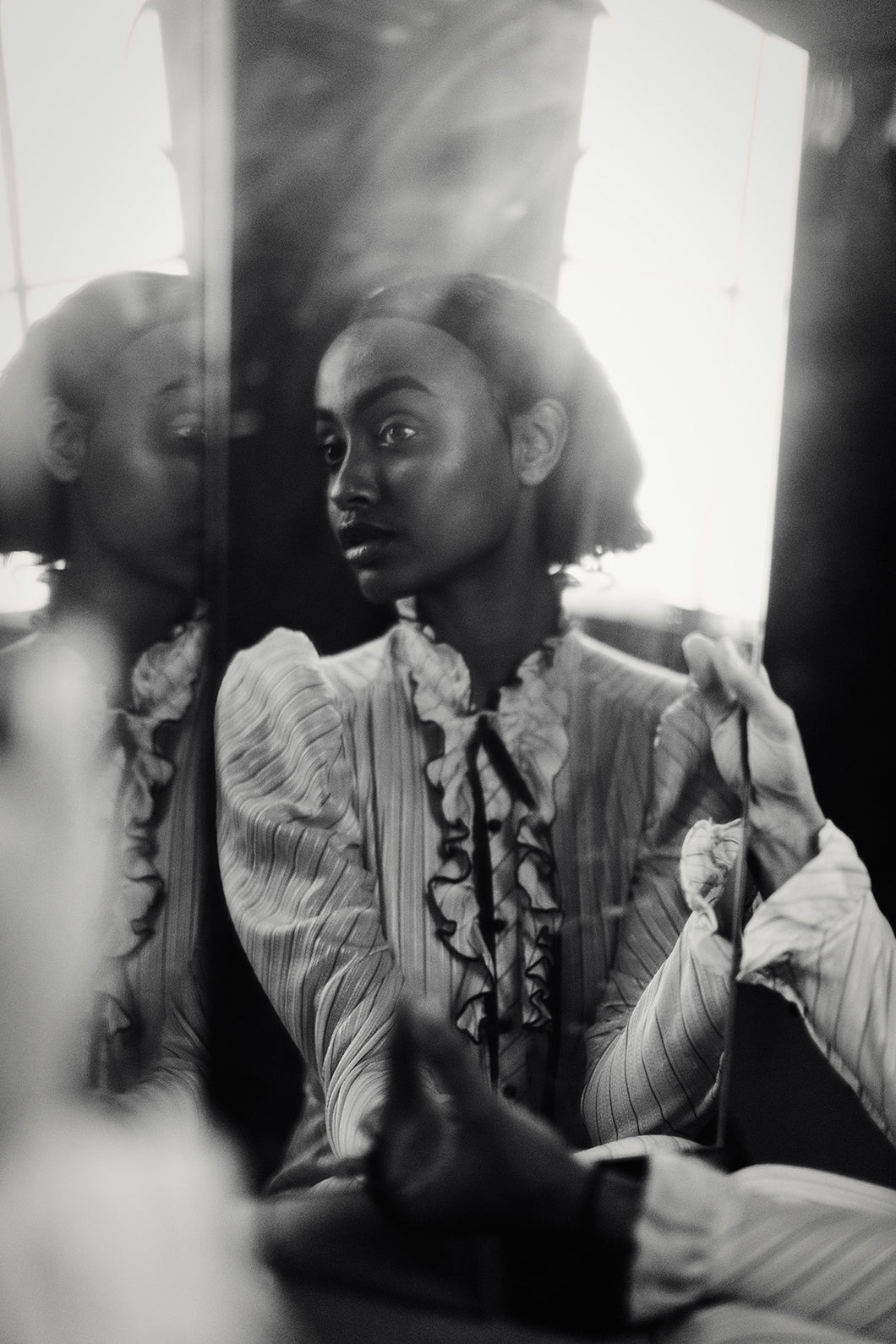 Fine Art Photography 'Echoing Heart' - A striking black and white portrait reflecting a woman in ruffled attire, showcasing the depth of emotions captured in this limited edition photography.