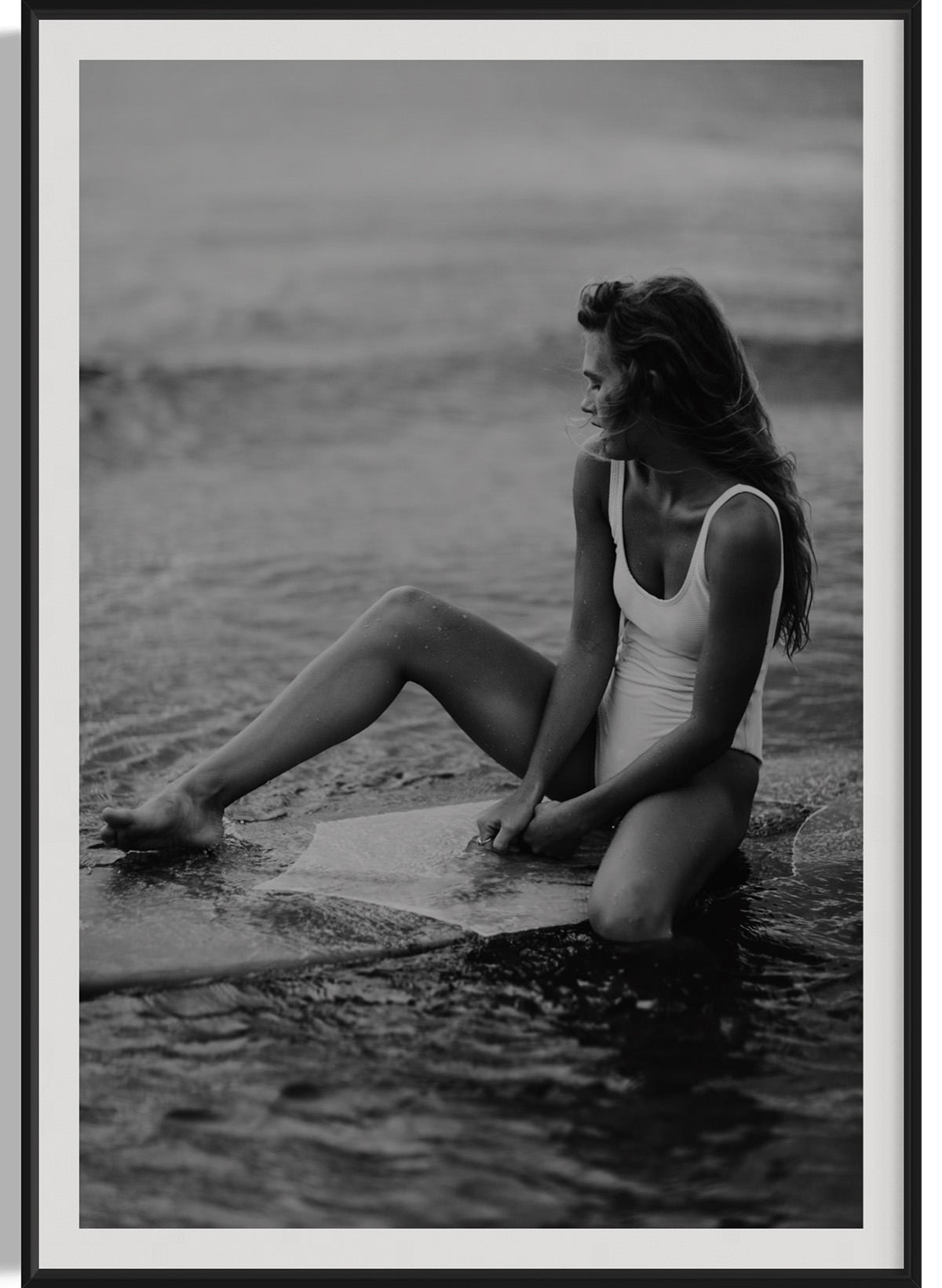 A detailed close-up of the stunning 'Riding Tide' photograph framed elegantly, showcasing the beauty of a woman in a swimsuit with the ocean backdrop, perfect for art lovers.